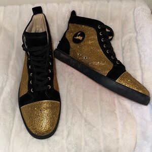 Christian Louboutin sneakers in gold and black.